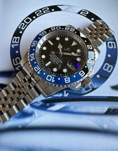 Load image into Gallery viewer, JP Black &amp; blue ceramic bezel watch on a jubilee bracalet
